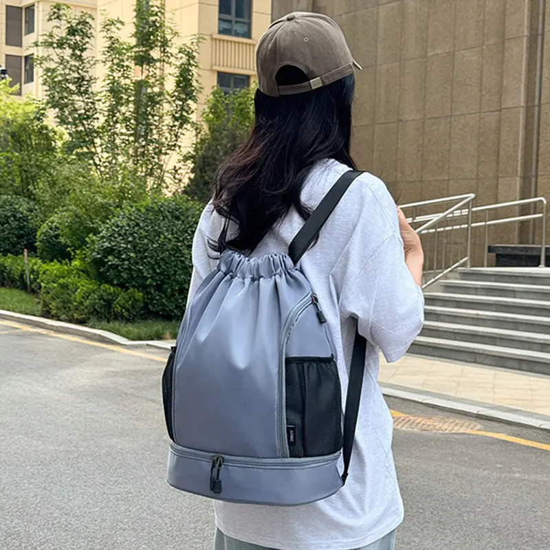 Lightweight drawstring backpack with a simple cord closure for gym, school, travel, shopping, and events, with options for custom colors and printed logos.